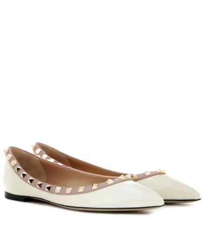 Shop Valentino Garavani Rockstud Patent Leather Ballerinas In White