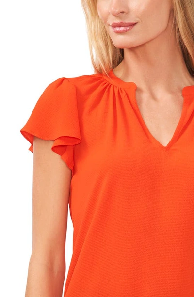 Cece Flutter Sleeve Split Neck Top In Poppy Red