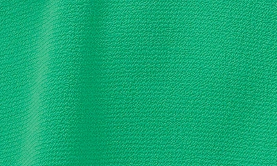 Shop Cece Flutter Sleeve Split Neck Top In Vivid Green