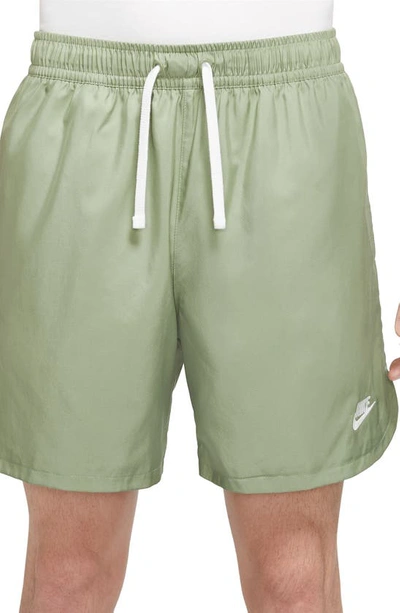Shop Nike Woven Lined Flow Shorts In Oil Green/ White