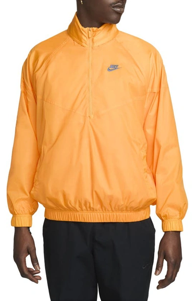 Shop Nike Water Repellent Half Zip Pullover In Sundial/ Diffused Blue
