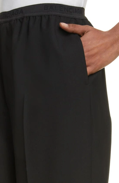 Shop Balenciaga Logo Elastic Waist Wide Leg Wool Pants In Black