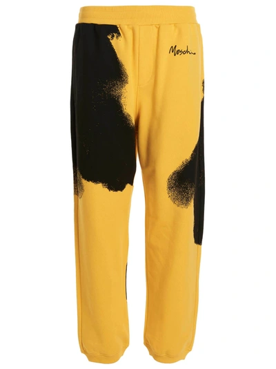 Shop Moschino All-over Print Joggers In Yellow