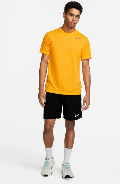 Shop Nike Dri-fit Legend T-shirt In University Gold/ Black