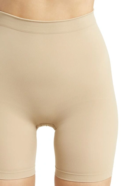 Shop Skims Seamless Sculpt Mid Thigh Shorts In Clay