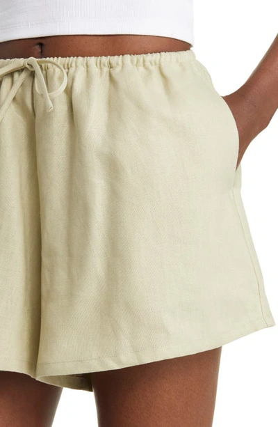 Shop Reformation Zoey Linen Shorts In Dried Herbs
