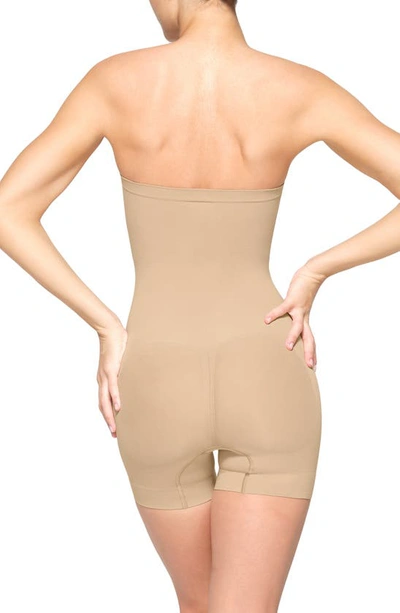 Shop Skims Seamless Sculpt Strapless Shortie Bodysuit In Clay