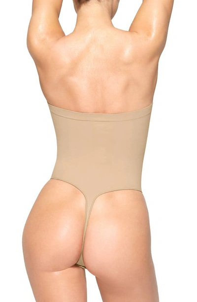 Skims Beige Seamless Sculpt Deep Plunge Thong Bodysuit In Clay