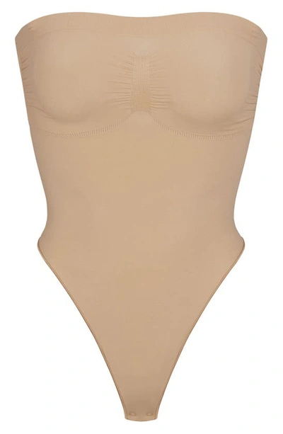 Skims Beige Seamless Sculpt Deep Plunge Thong Bodysuit In Clay