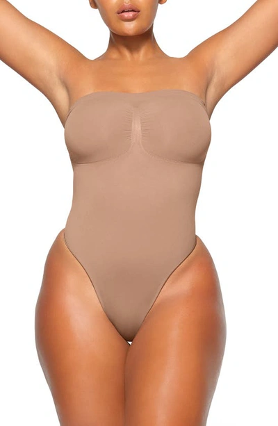 Shop Skims Seamless Sculpt Strapless Bodysuit In Sienna