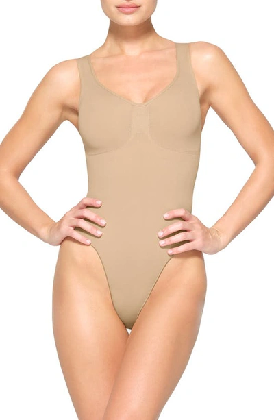 Shop Skims Seamless Sculpt Scoop Neck Thong Bodysuit In Clay
