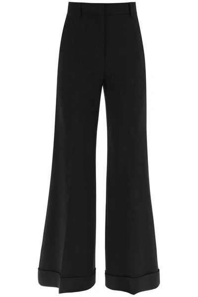 Shop Moschino Flared Trousers In Stretch Cady