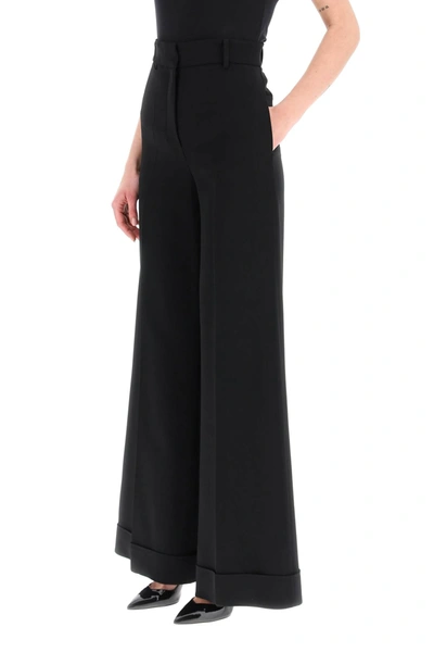Shop Moschino Flared Trousers In Stretch Cady