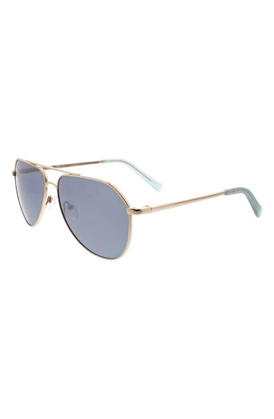 Shop Hurley 60mm Polarized Round Sunglasses In Gold/ Blue
