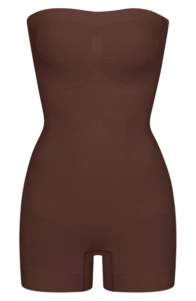 Shop Skims Seamless Sculpt Strapless Shortie Bodysuit In Cocoa