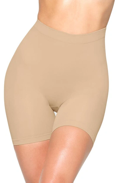 Shop Skims Seamless Sculpt Mid Thigh Shorts In Clay