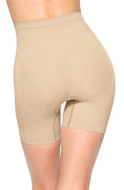 Shop Skims Seamless Sculpt Mid Thigh Shorts In Clay