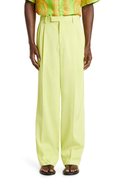 Shop Versace Fluid Satin Twill Pleat Front Pants In Lime