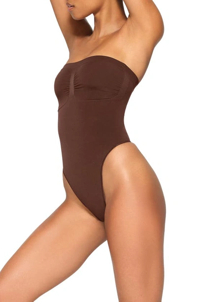 Shop Skims Seamless Sculpt Strapless Bodysuit In Cocoa