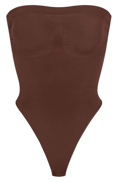 Shop Skims Seamless Sculpt Strapless Bodysuit In Cocoa