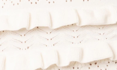 Edikted Robin Pointelle Ruffle Strapless Knit Romper In Cream