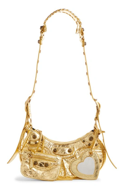 Shop Balenciaga Extra Small Le Cagole Metallic Calfskin Shoulder Bag In Gold