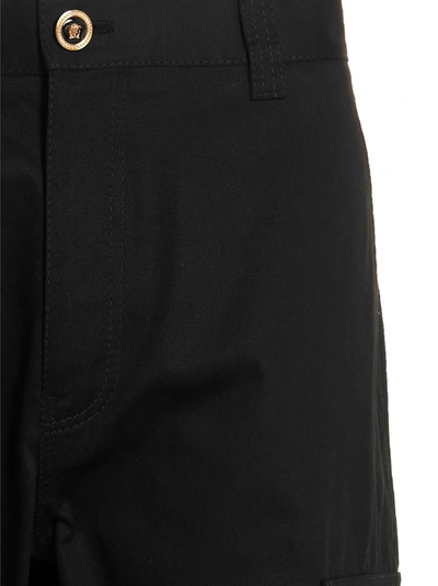 Shop Versace Logo Button Trousers