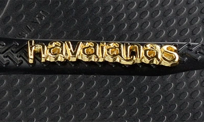 Shop Havaianas Slim Logo Metallic Flip Flop In Black/ Golden