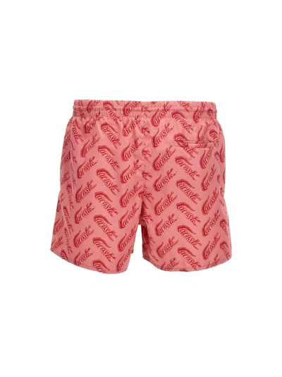 Shop Lacoste Logo Print Swimming Trunks Beachwear Pink