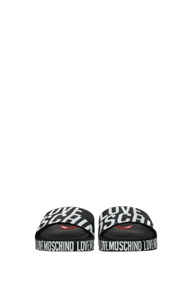 Shop Love Moschino Slippers And Clogs Polyurethane Black