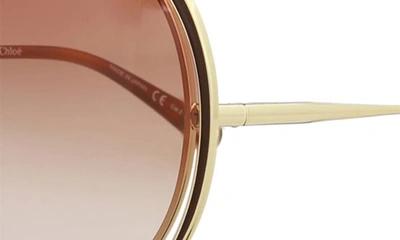 Shop Chloé Novelty 61mm Round Sunglasses In Gold Pink