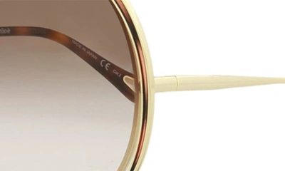 Shop Chloé Novelty 61mm Round Sunglasses In Gold Brown