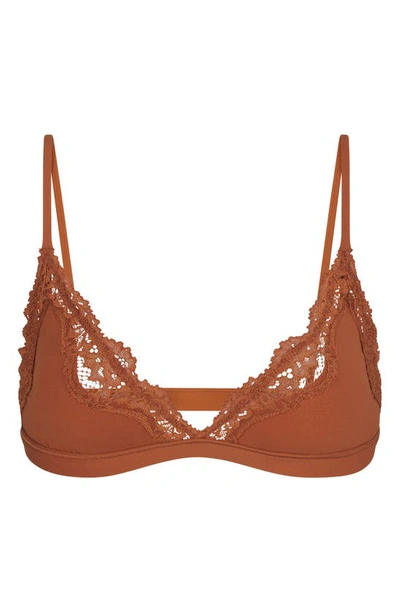 Shop Skims Fits Everybody Lace Triangle Bralette In Bronze