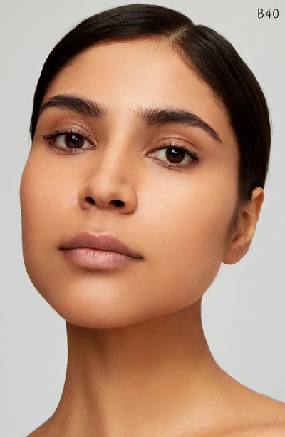 Clé De Peau Beauté Radiant Fluid Natural Foundation In B40 - Light Tan Beige