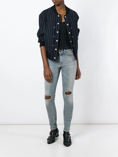 Shop Saint Laurent Ripped Skinny Jeans In Blue