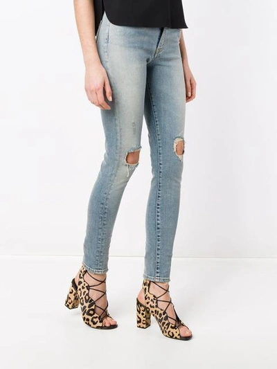 Shop Saint Laurent Skinny Distressed Jeans