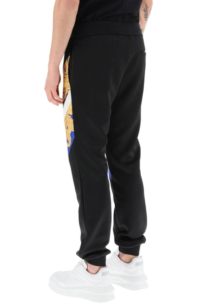 Shop Versace Interlock Track Pants With Barocco 660 Inserts