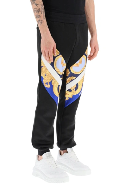 Shop Versace Interlock Track Pants With Barocco 660 Inserts