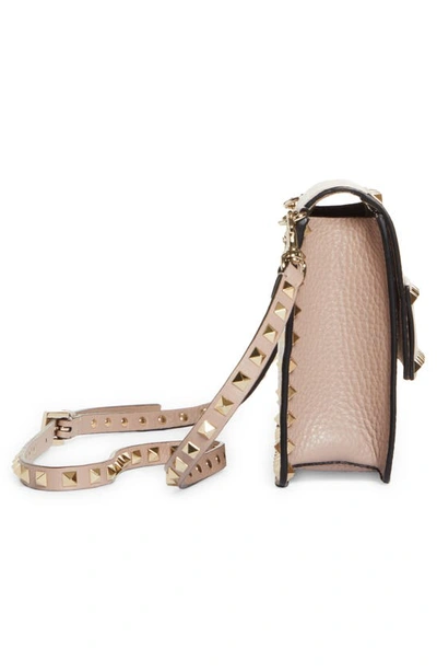 Shop Valentino Rockstud Leather Crossbody Bag In Poudre