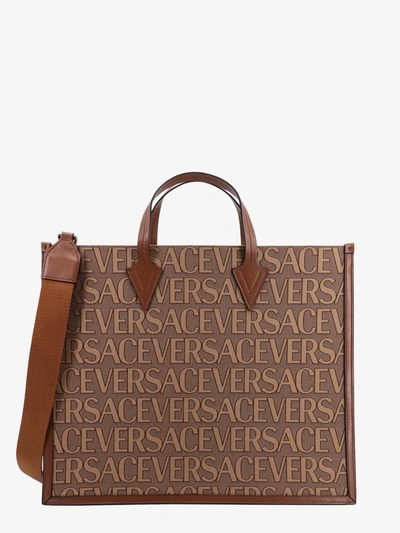 Shop Versace Handbag In Brown