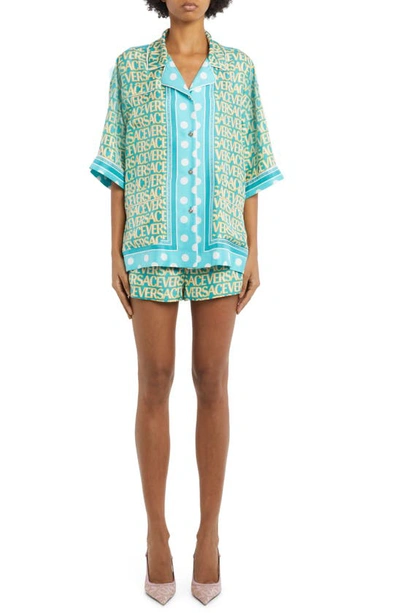 Shop Versace Logomania Print Silk Shorts In 5v550 Turquoise Avory