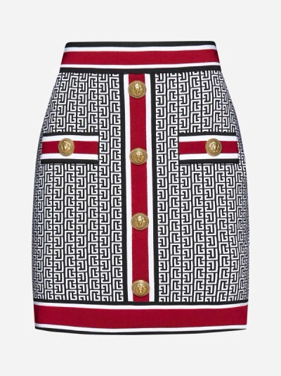 Shop Balmain Monogram Knit Miniskirt In Black,white,red