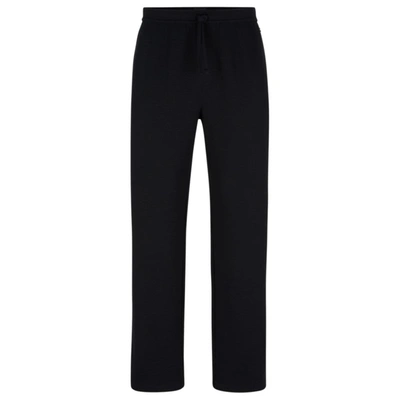 Shop Hugo Boss Waffle Cotton-blend Pajama Bottoms With Logo Embroidery In Black