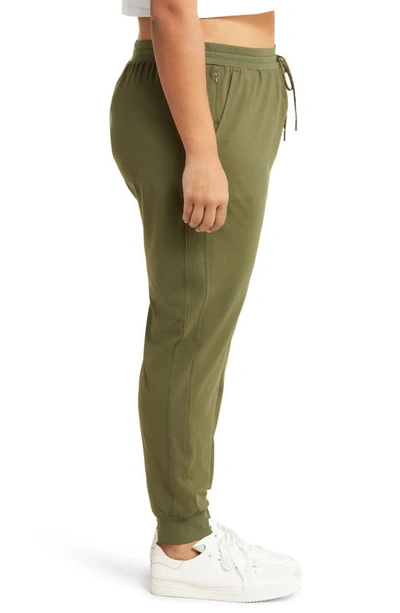 Shop Zella Live-in Pocket Joggers In Olive Night
