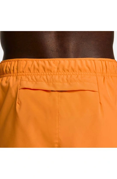 Shop Nike Dri-fit Challenger 5-inch Brief Lined Shorts In Orange/ Reflective Silver