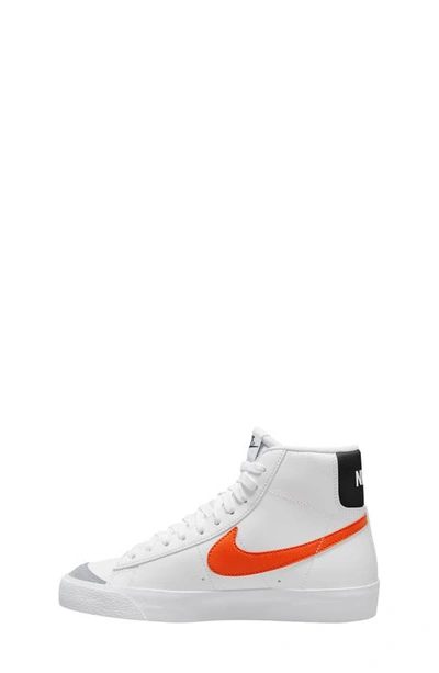 Shop Nike Kids' Blazer Mid '77 Vintage Sneaker In White/ Orange/ Grey/ Black
