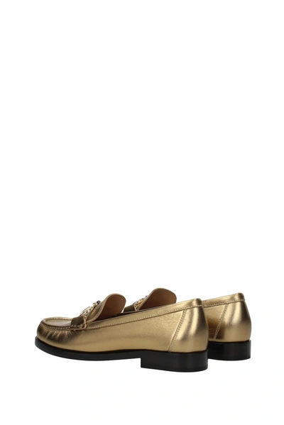 Shop Ferragamo Loafers Rolo Leather Gold