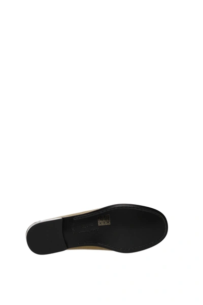 Shop Ferragamo Loafers Rolo Leather Gold