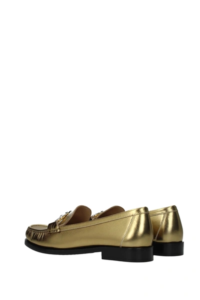 Shop Ferragamo Loafers Rolo Leather Gold