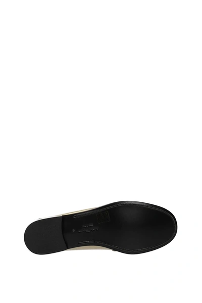 Shop Ferragamo Loafers Rolo Leather Gold